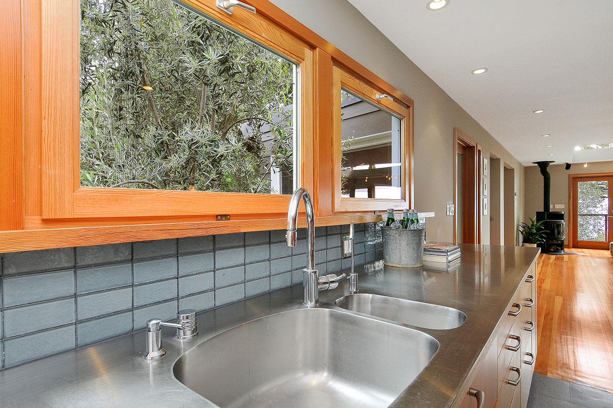 214 Swett Road Woodside, CA 94062 - Photo 17 of 67 a kitchen with granite countertop a sink and a large window