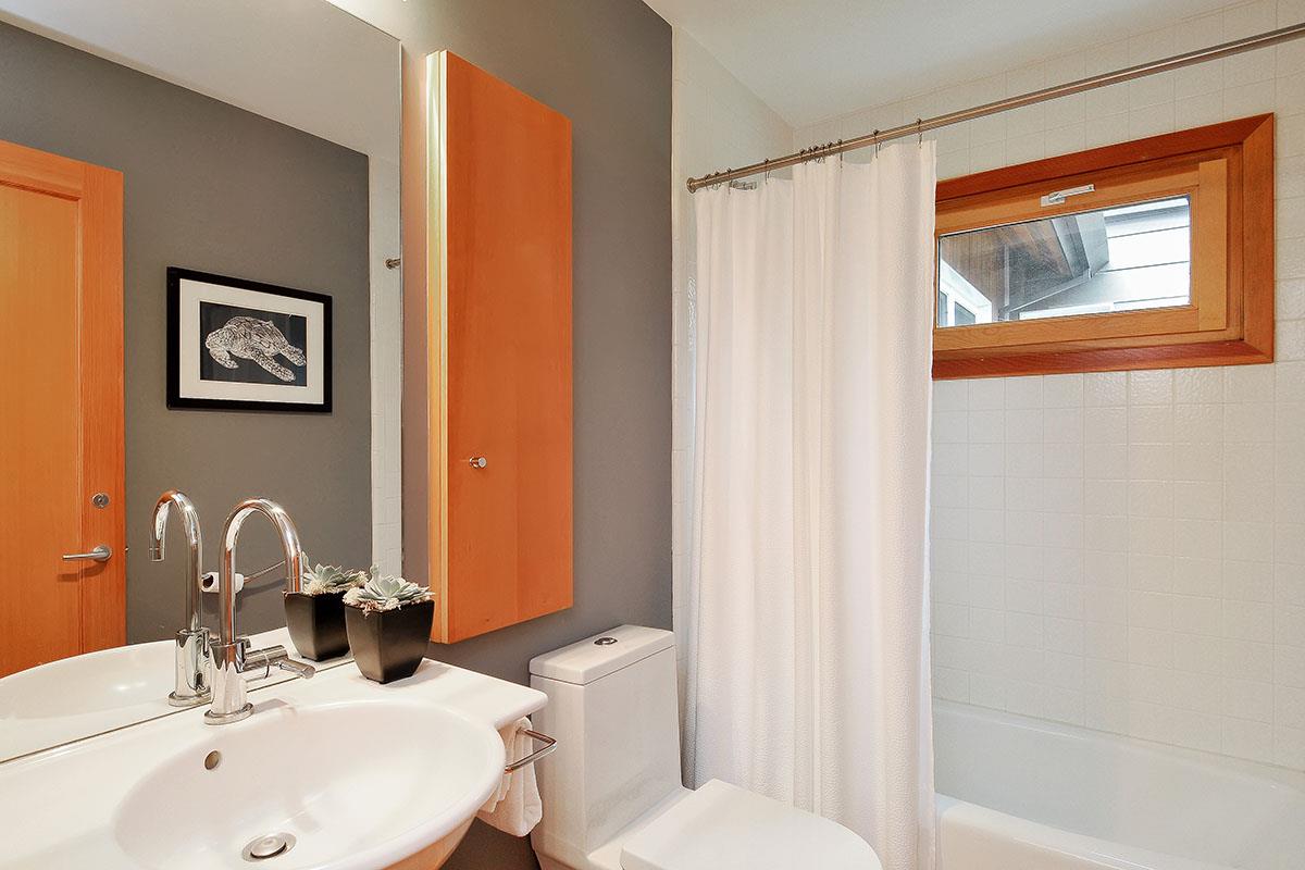 214 Swett Road Woodside, CA 94062 - Photo 31 of 67 a bathroom with a sink and a mirror