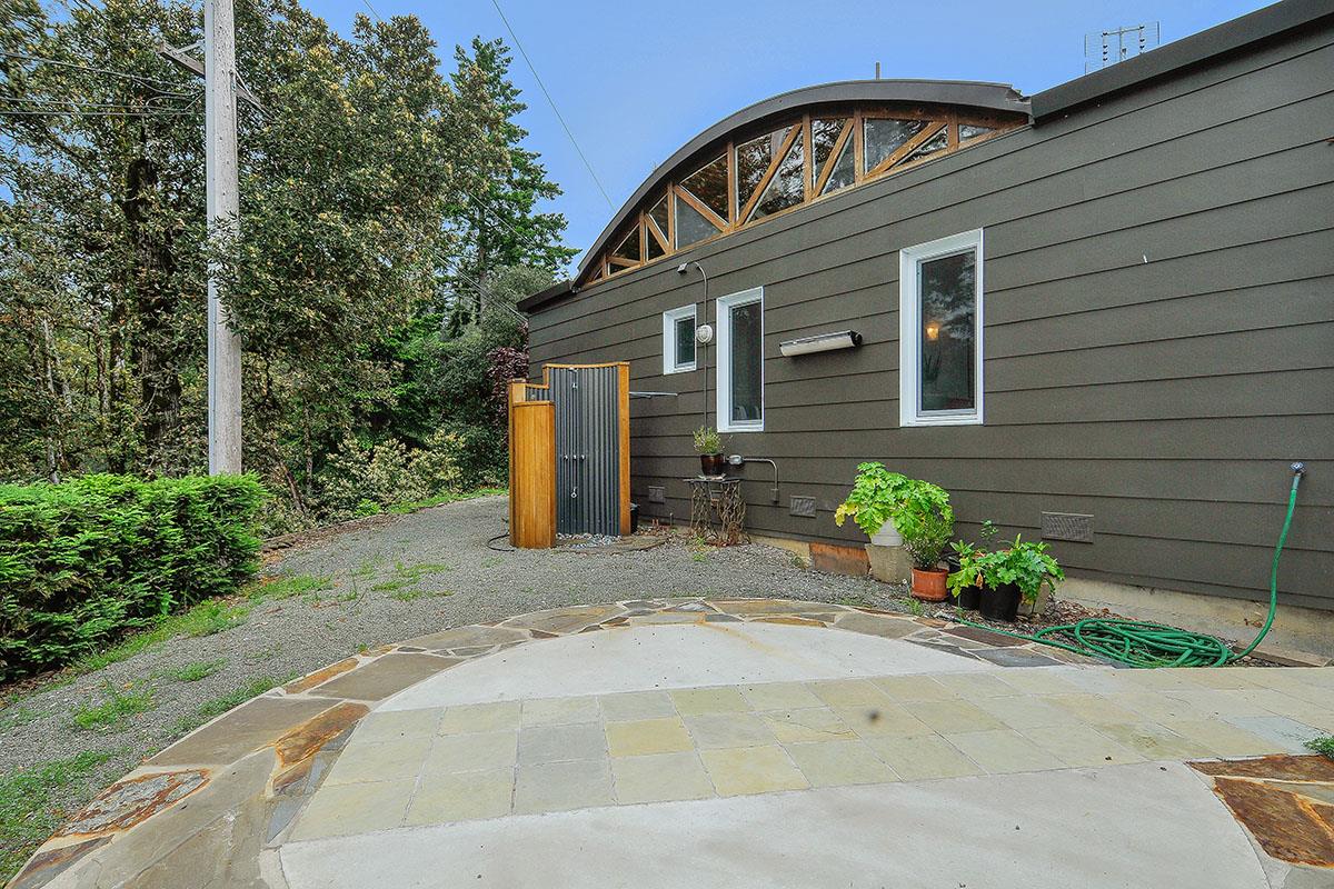 214 Swett Road Woodside, CA 94062 - Photo 44 of 67 a front view of a house with a yard and a garage