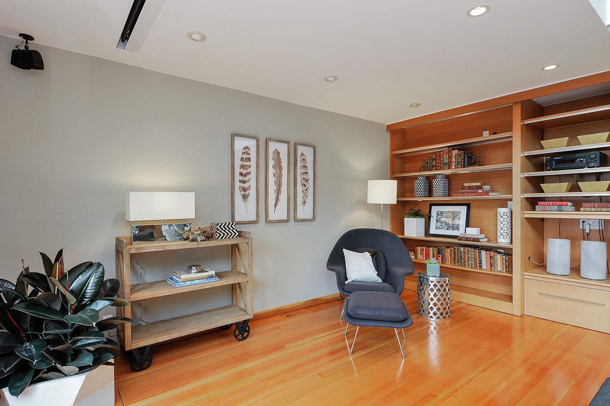 214 Swett Road Woodside, CA 94062 - Photo 7 of 67 a living room with furniture and a book shelf
