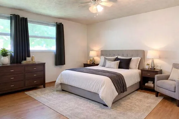 a bedroom with a bed and window