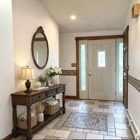 a view of a room that has a table and a mirror