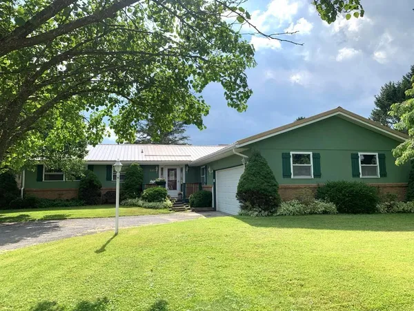 a backyard of a house with lots of green space