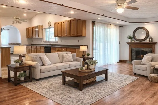 a living room with furniture and a fireplace