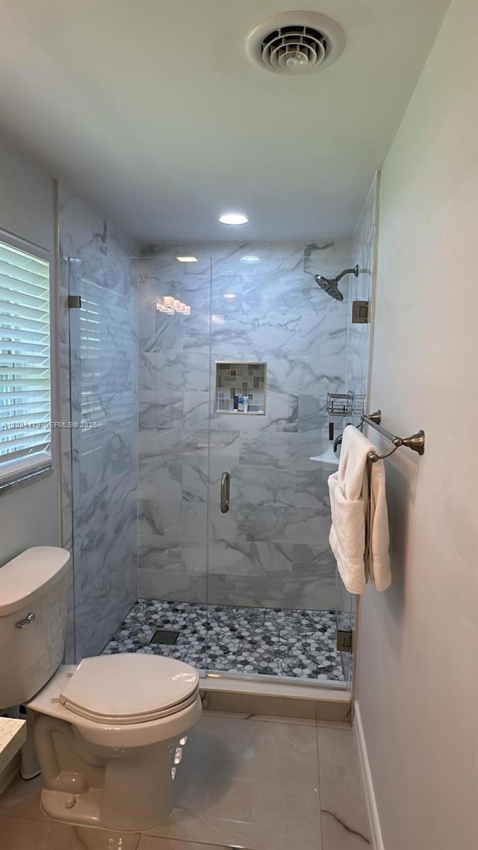 2212 Club House Road North Fort Myers, FL 33917 - Photo 23 of 40 a bathroom with a toilet and a shower