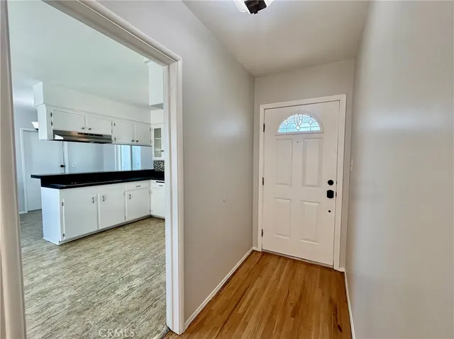a view of a kitchen from the hallway
