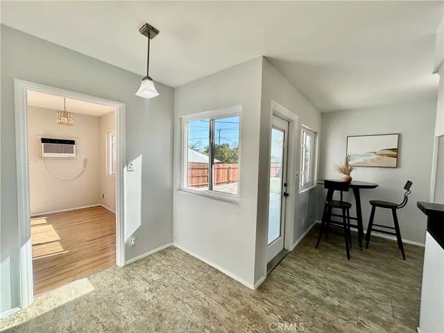 a view of a livingroom with furniture and windows