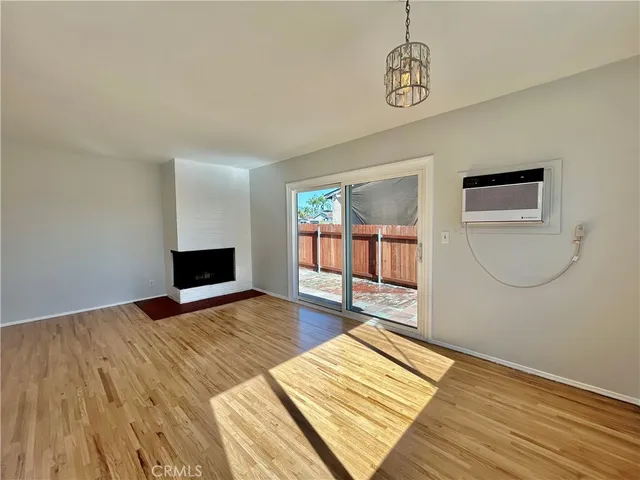 a view of livingroom with hardwood floor and kitchen view