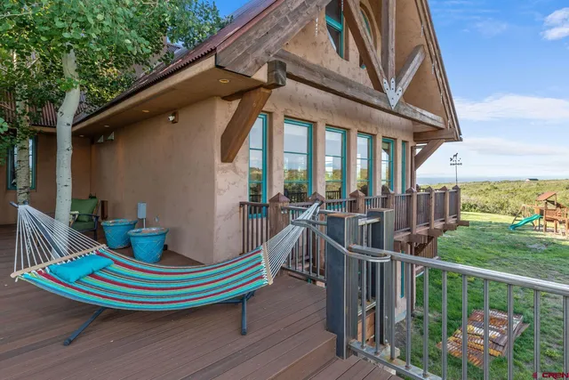 a living room with furniture and a lamp