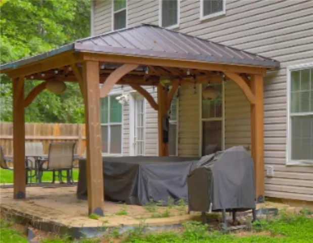 a living room with furniture and a dining table with kitchen view