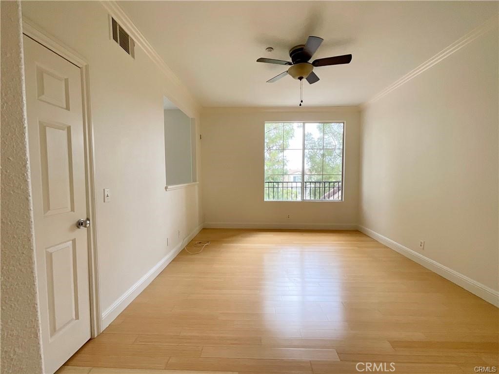 511 Birch Grove Irvine, CA 92618 - Photo 2 of 15 a view of an empty room and a window and a ceiling fan