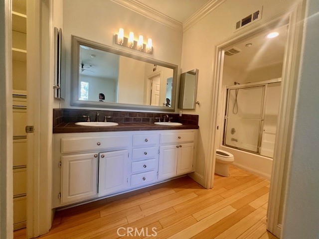 511 Birch Grove Irvine, CA 92618 - Photo 5 of 15 a bathroom with a granite countertop sink mirror and