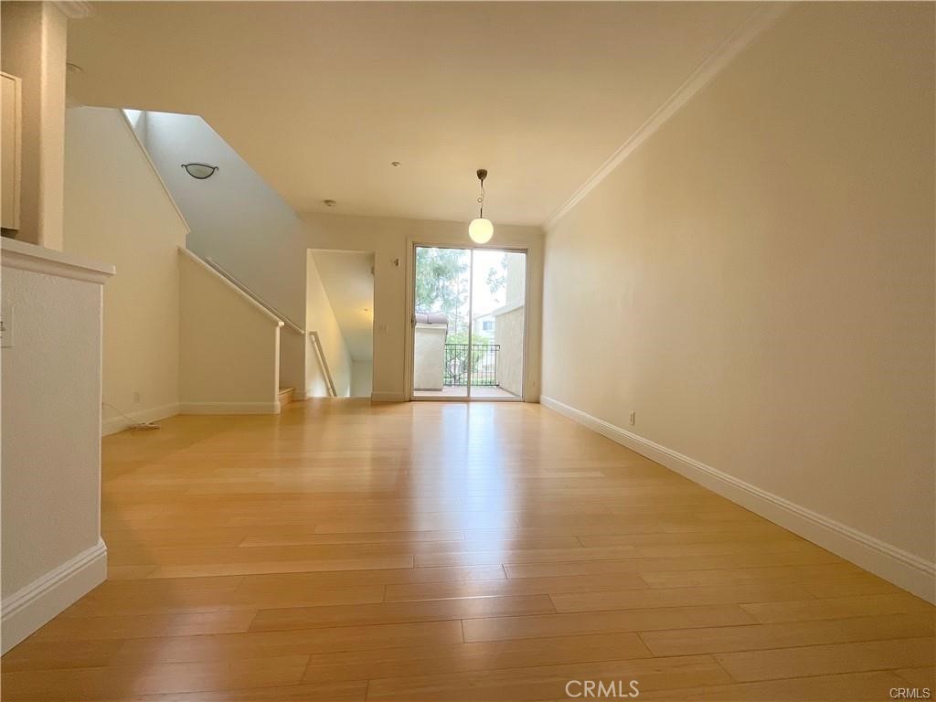 511 Birch Grove Irvine, CA 92618 - Photo 9 of 15 an empty room with wooden floor and windows