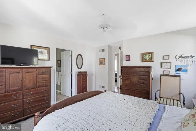 a bedroom with a bed and furniture