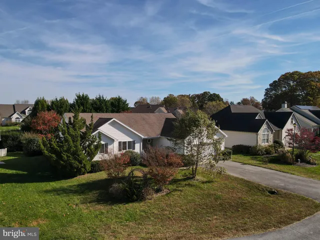 a aerial view of a house with a yard