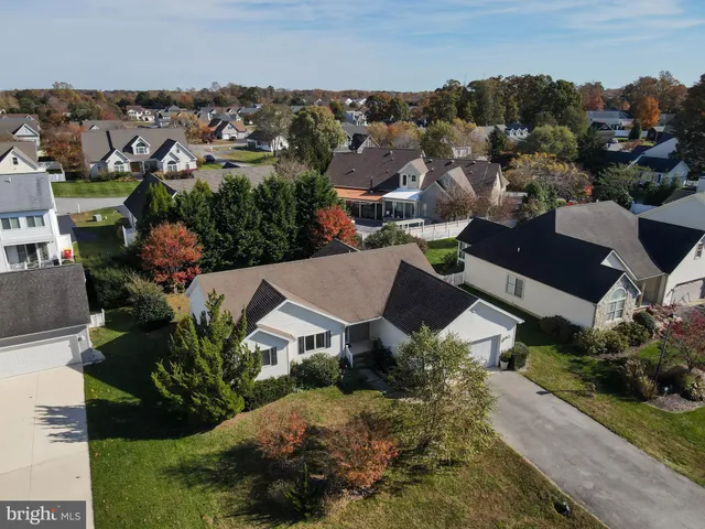 an aerial view of a house with a garden