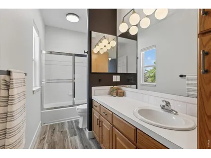 a bathroom with a sink vanity and a mirror