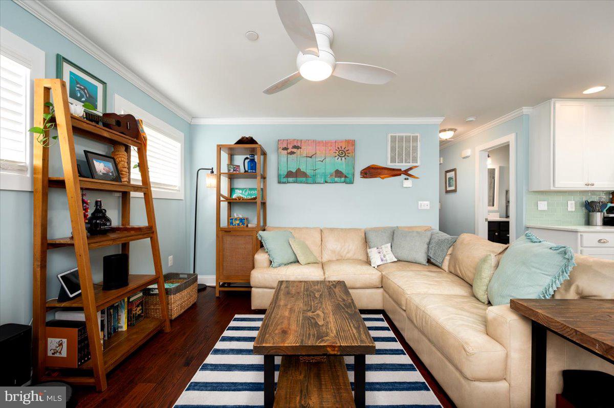 57 Spa Road Annapolis, MD 21401 - Photo 5 of 39 a living room with furniture and a book shelf