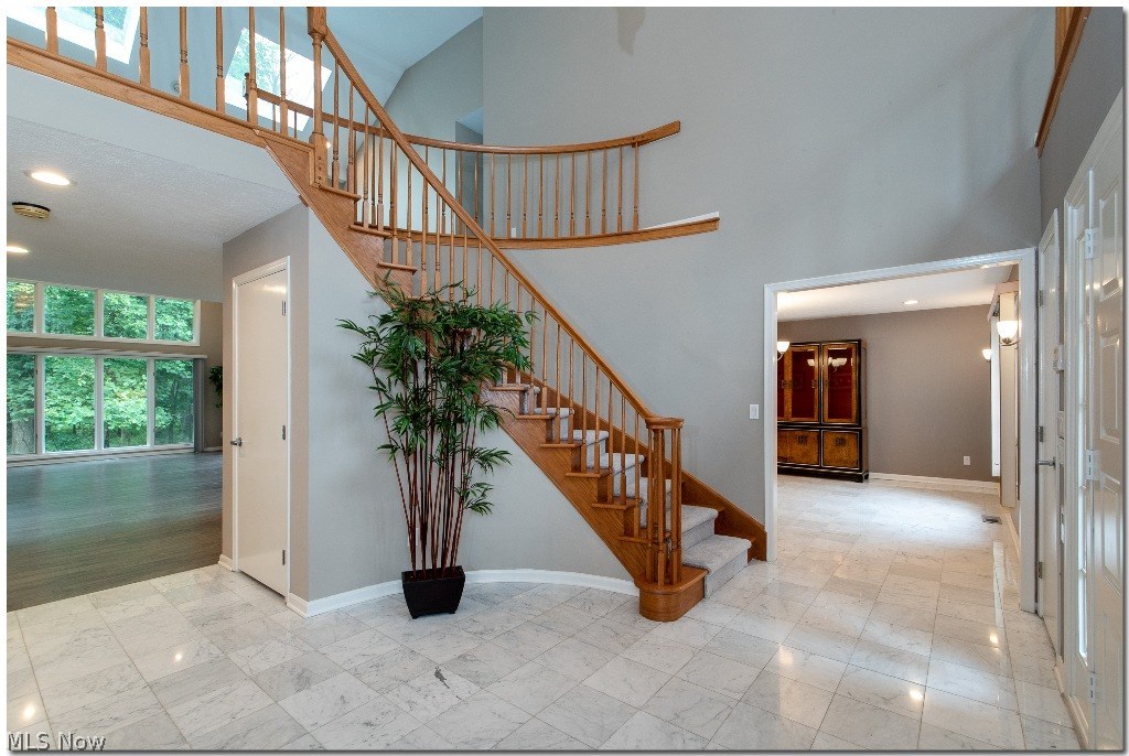 3225 Old Brainard Road Pepper Pike, OH 44124 - Photo 19 of 35 Inviting Two Story Foyer with Curved Staircase and Marble Floors