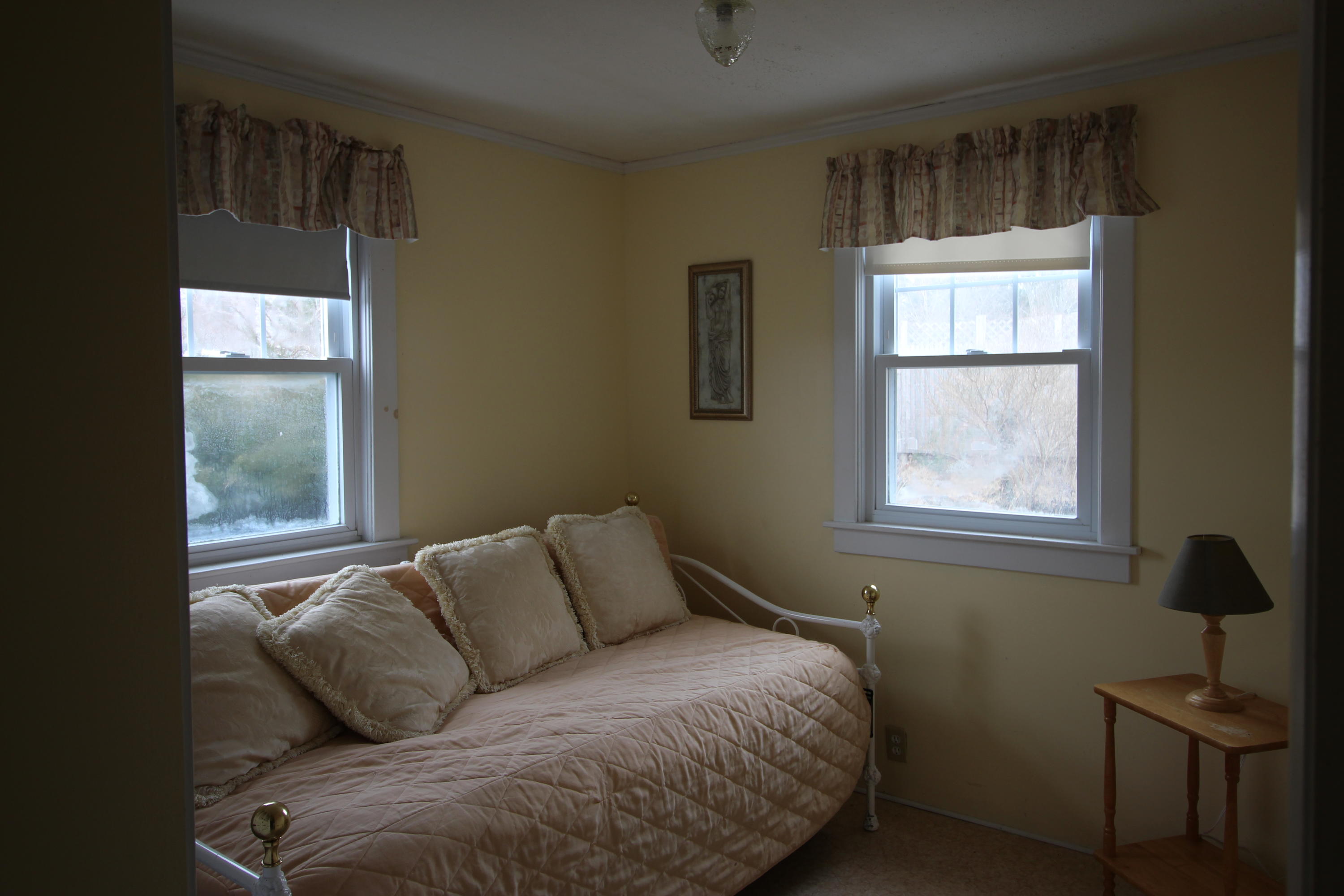 21 Knowles Heights Road Truro, MA 02666 - Photo 13 of 38 a bedroom with a bed and wooden floor