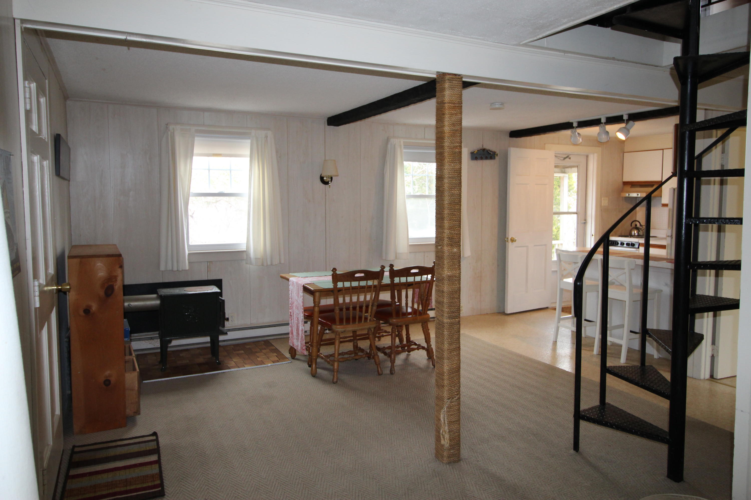 21 Knowles Heights Road Truro, MA 02666 - Photo 19 of 38 a view of a livingroom with furniture and a window