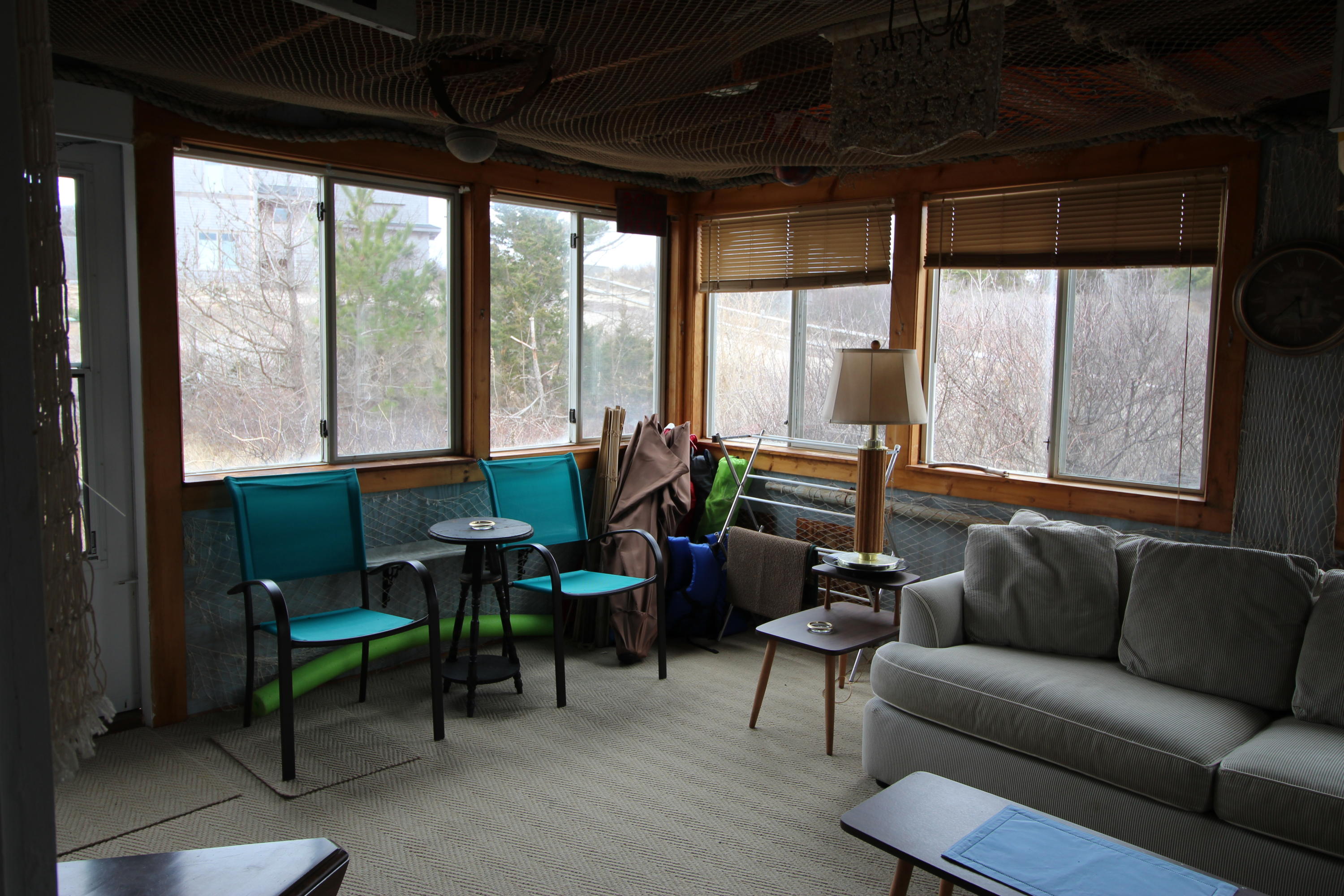 21 Knowles Heights Road Truro, MA 02666 - Photo 20 of 38 a living room with furniture and a floor to ceiling window