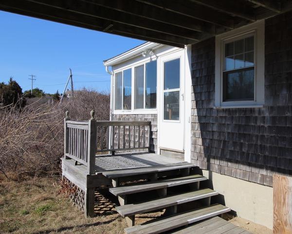 21 Knowles Heights Road Truro, MA 02666 - Photo 2 of 38 a front view of a house with a garden