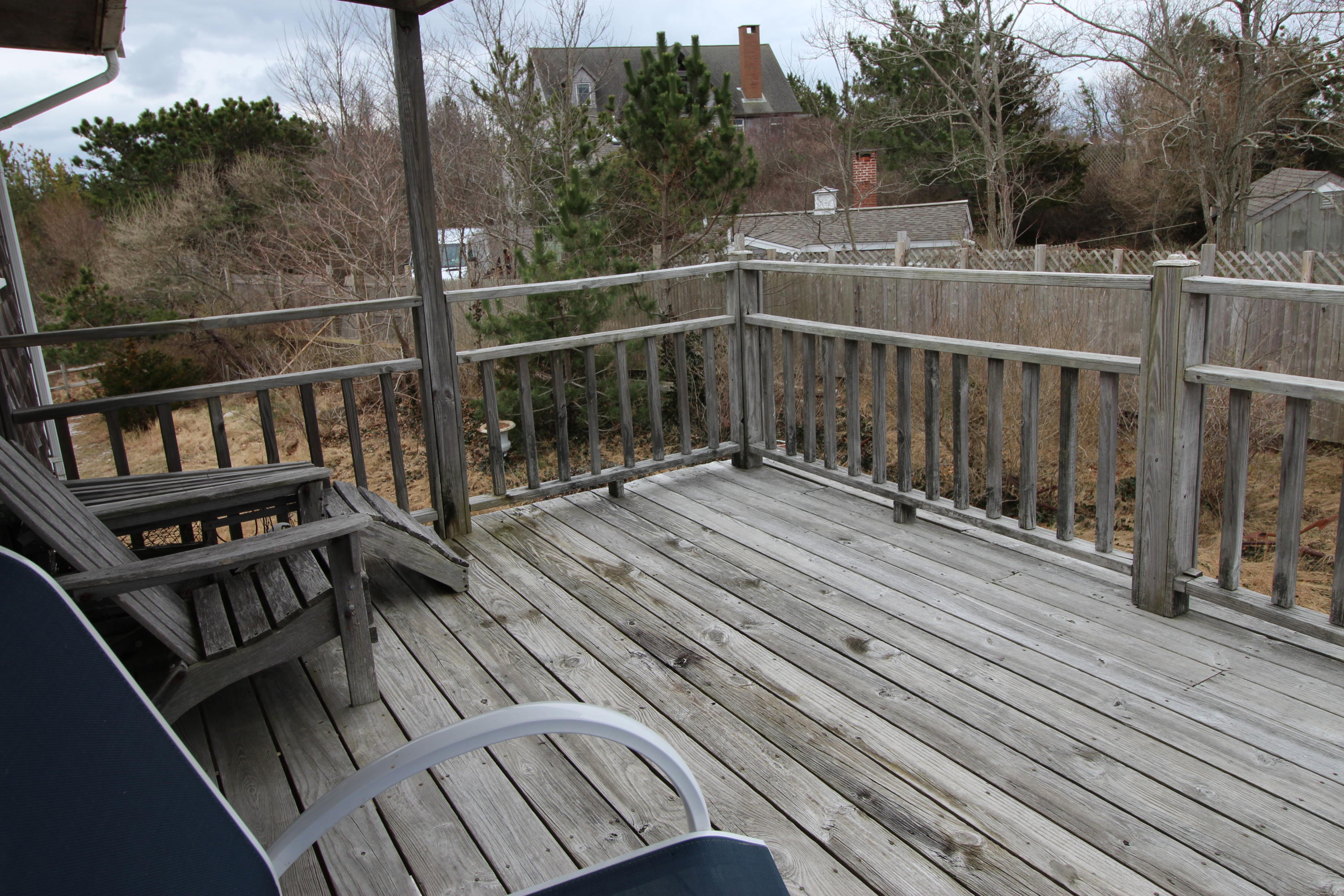 21 Knowles Heights Road Truro, MA 02666 - Photo 30 of 38 a view of a balcony with wooden floor and fence