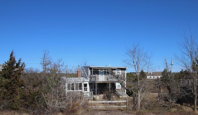 21 Knowles Heights Road Truro, MA 02666 - Photo 3 of 38 a front view of a house with a yard