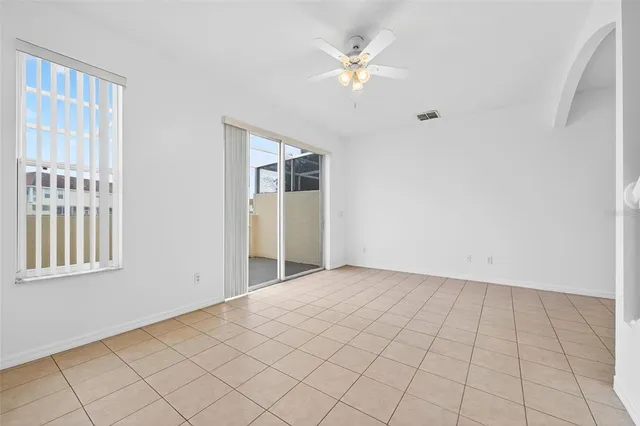 a kitchen with stainless steel appliances kitchen island granite countertop a refrigerator and a stove top oven