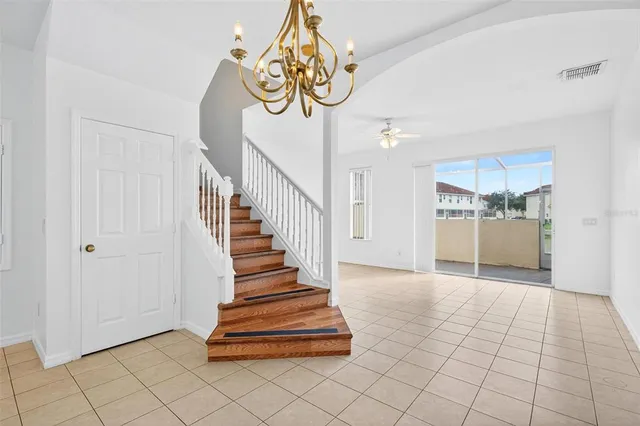 a view of entryway and kitchen