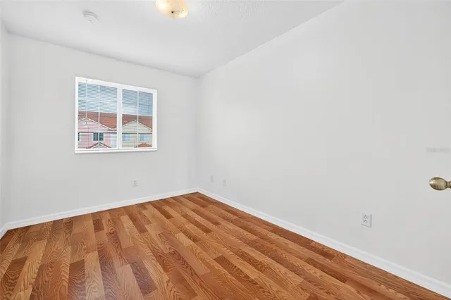 a view of a street with a building in the background