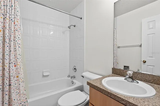 an aerial view of residential building and lake