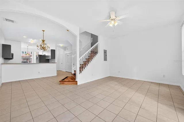 a view of a kitchen with a sink and wooden floor