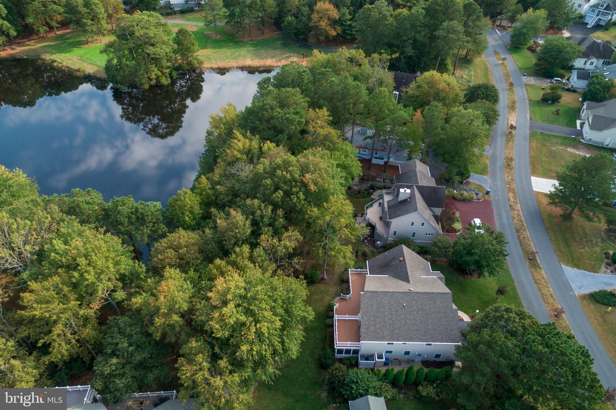 609 Bethany Loop Bethany Beach, DE 19930 - Photo 6 of 41 Aerial view of home and pond - note the large deck