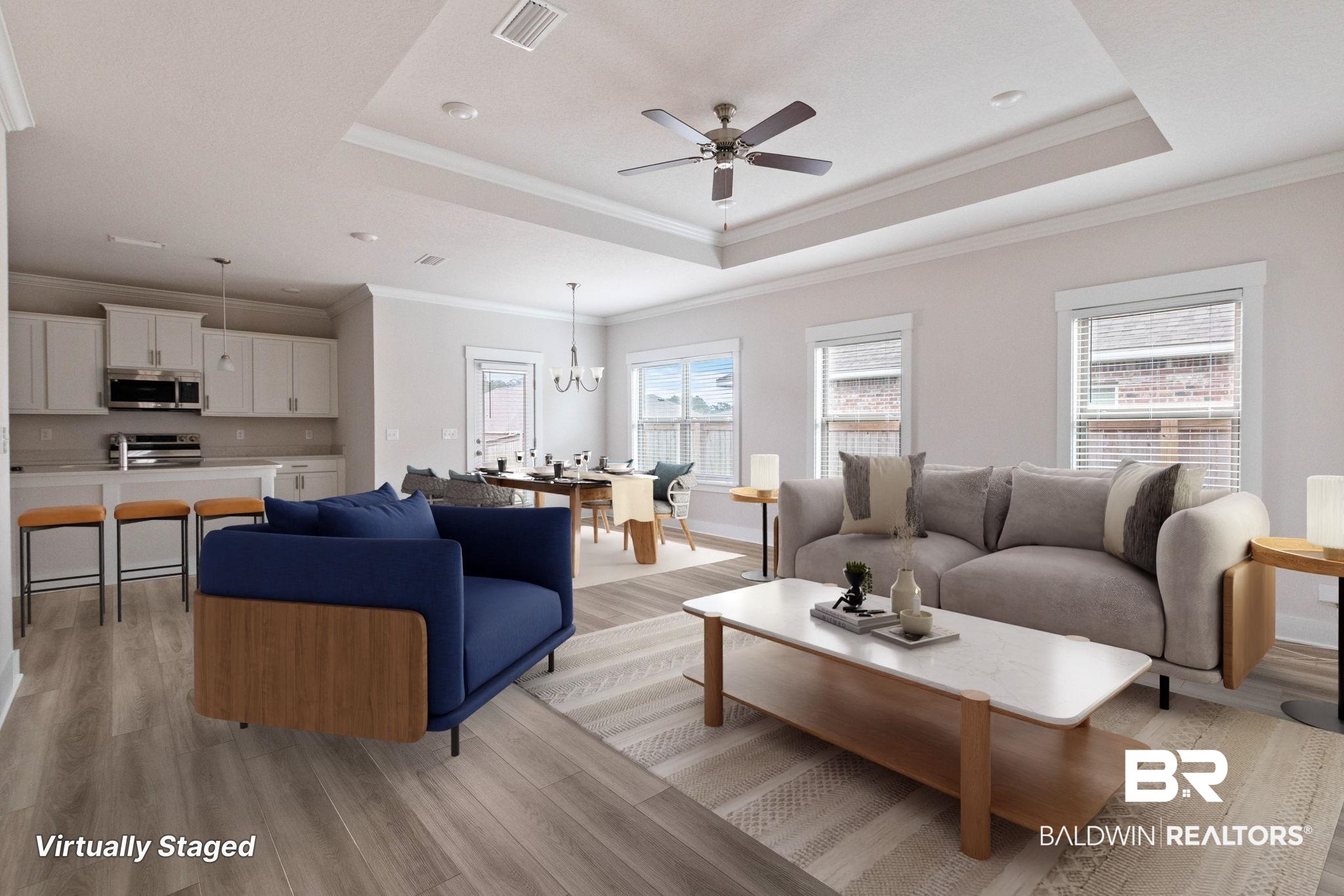 1710 Grouse Street Foley, AL 36535 - Photo 52 of 76 Open-concept living area featuring wood-finish flooring, a tray ceiling with a ceiling fan, and multiple windows