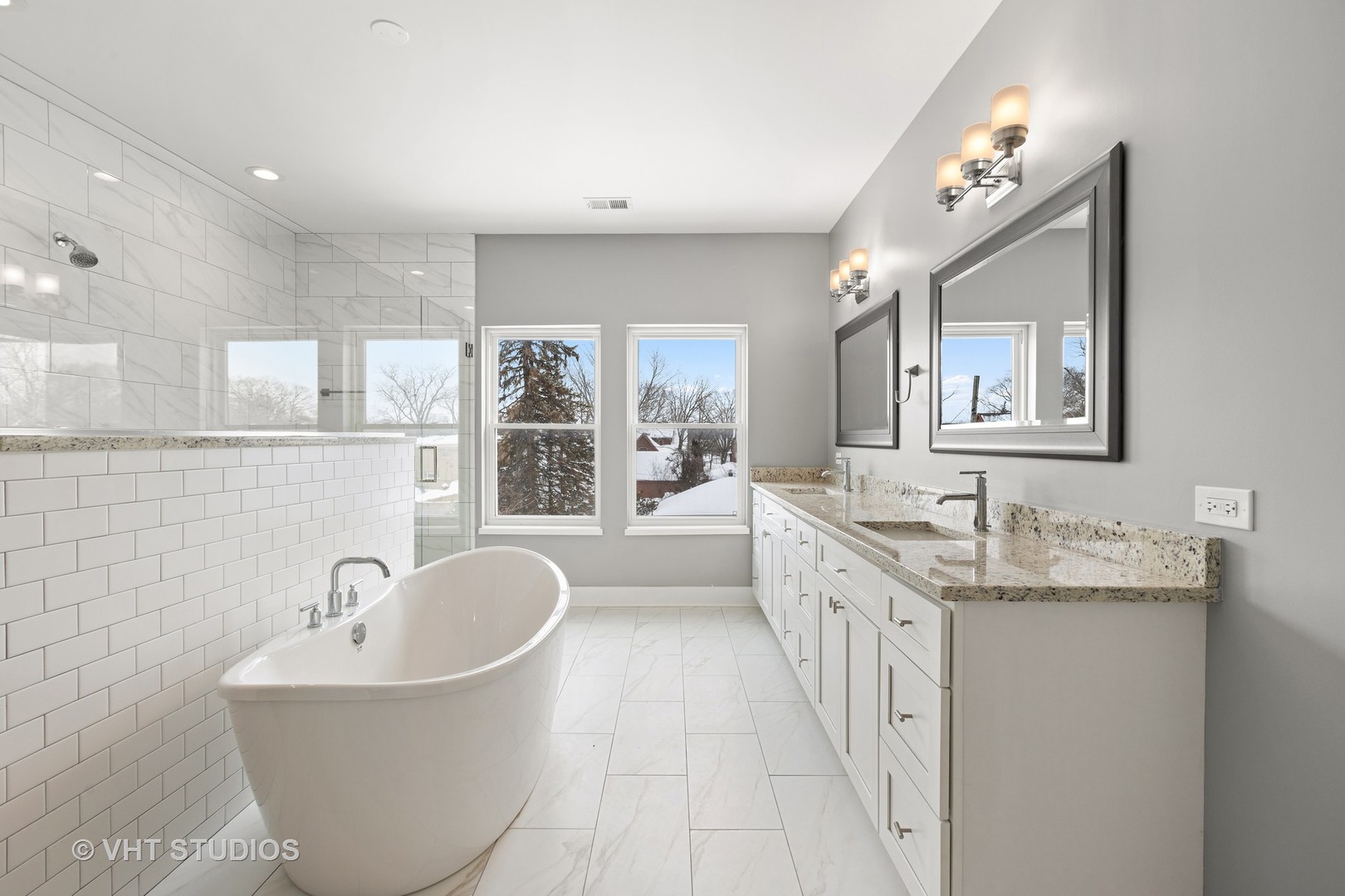 33 Northgate Road Riverside, IL 60546 - Photo 14 of 28 a spacious bathroom with a granite countertop tub a double vanity sink a mirror and a window