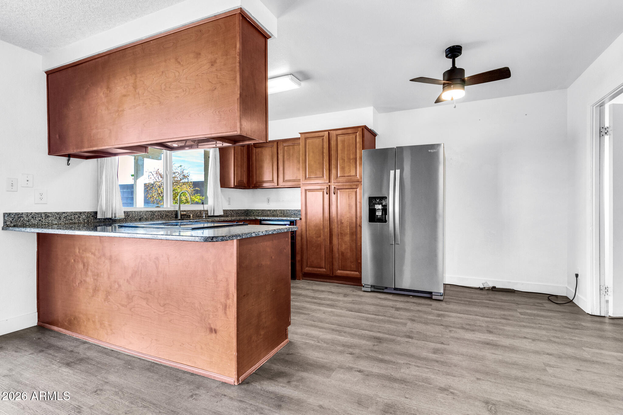 2024 East Rice Drive Tempe, AZ 85283 - Photo 12 of 39 a kitchen with stainless steel appliances granite countertop a refrigerator and a sink