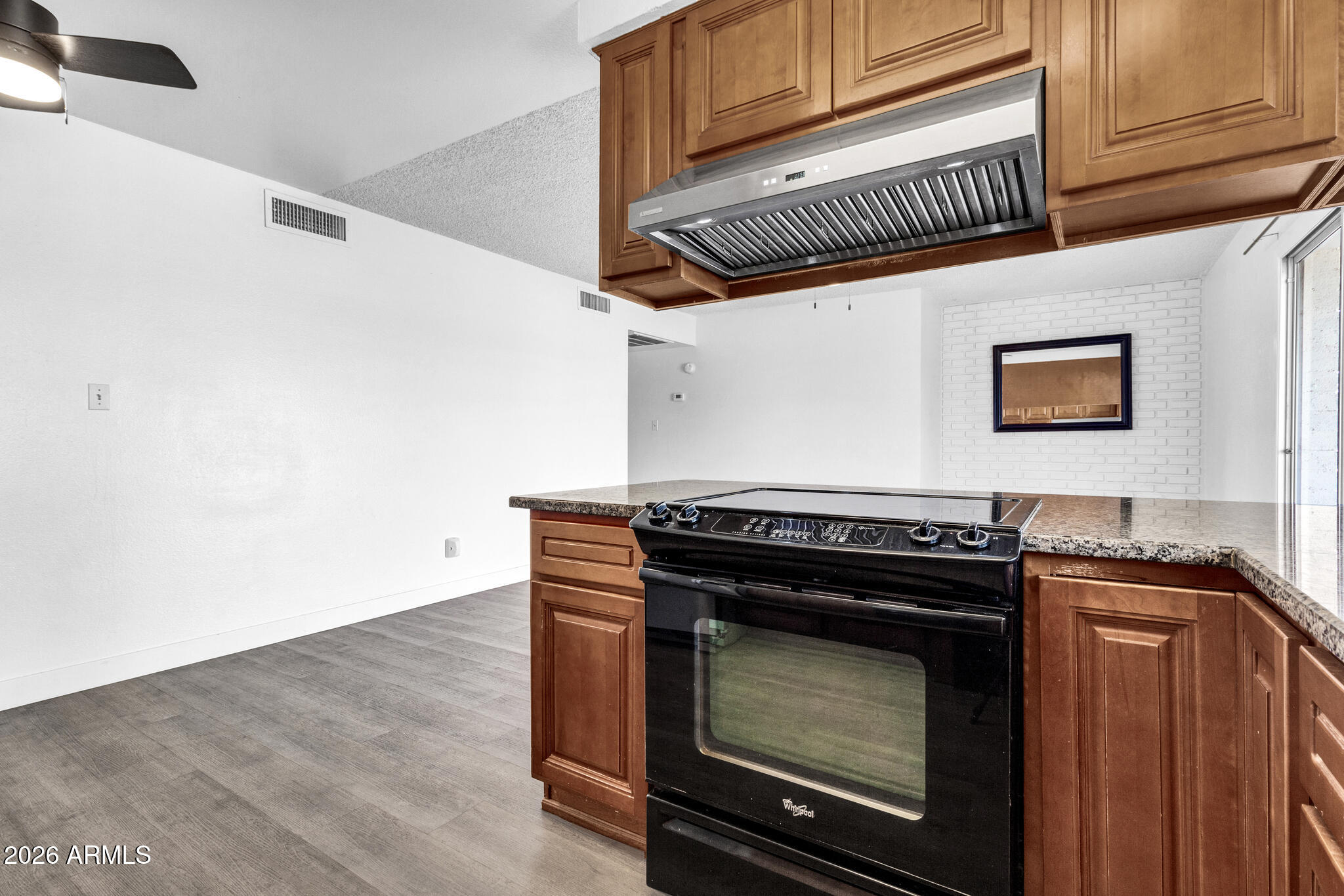 2024 East Rice Drive Tempe, AZ 85283 - Photo 15 of 39 a kitchen with granite countertop a stove and a cabinets