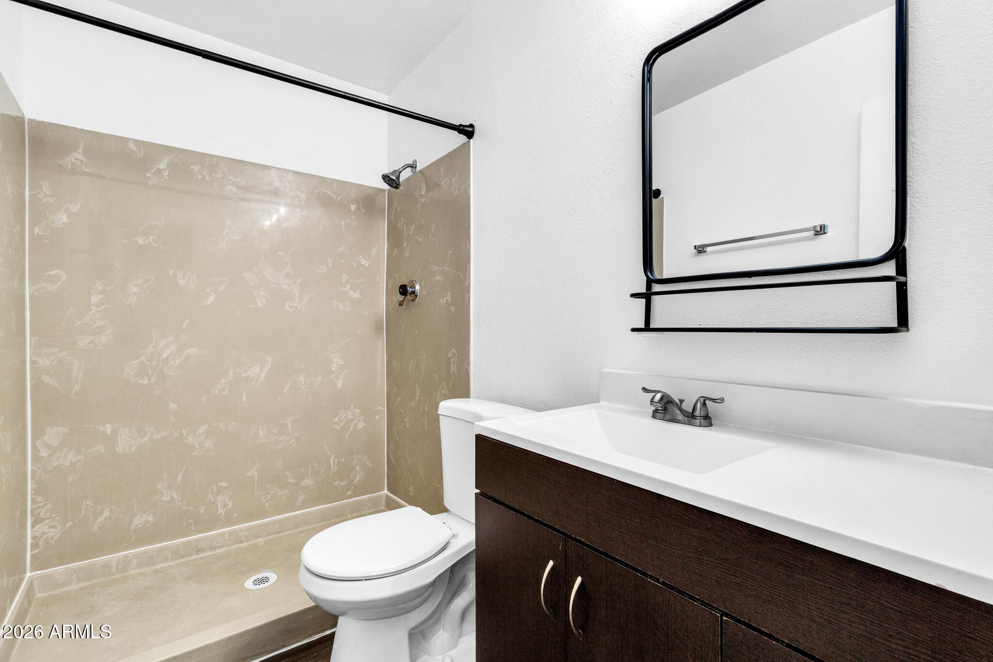 2024 East Rice Drive Tempe, AZ 85283 - Photo 19 of 39 a bathroom with a sink a toilet and shower