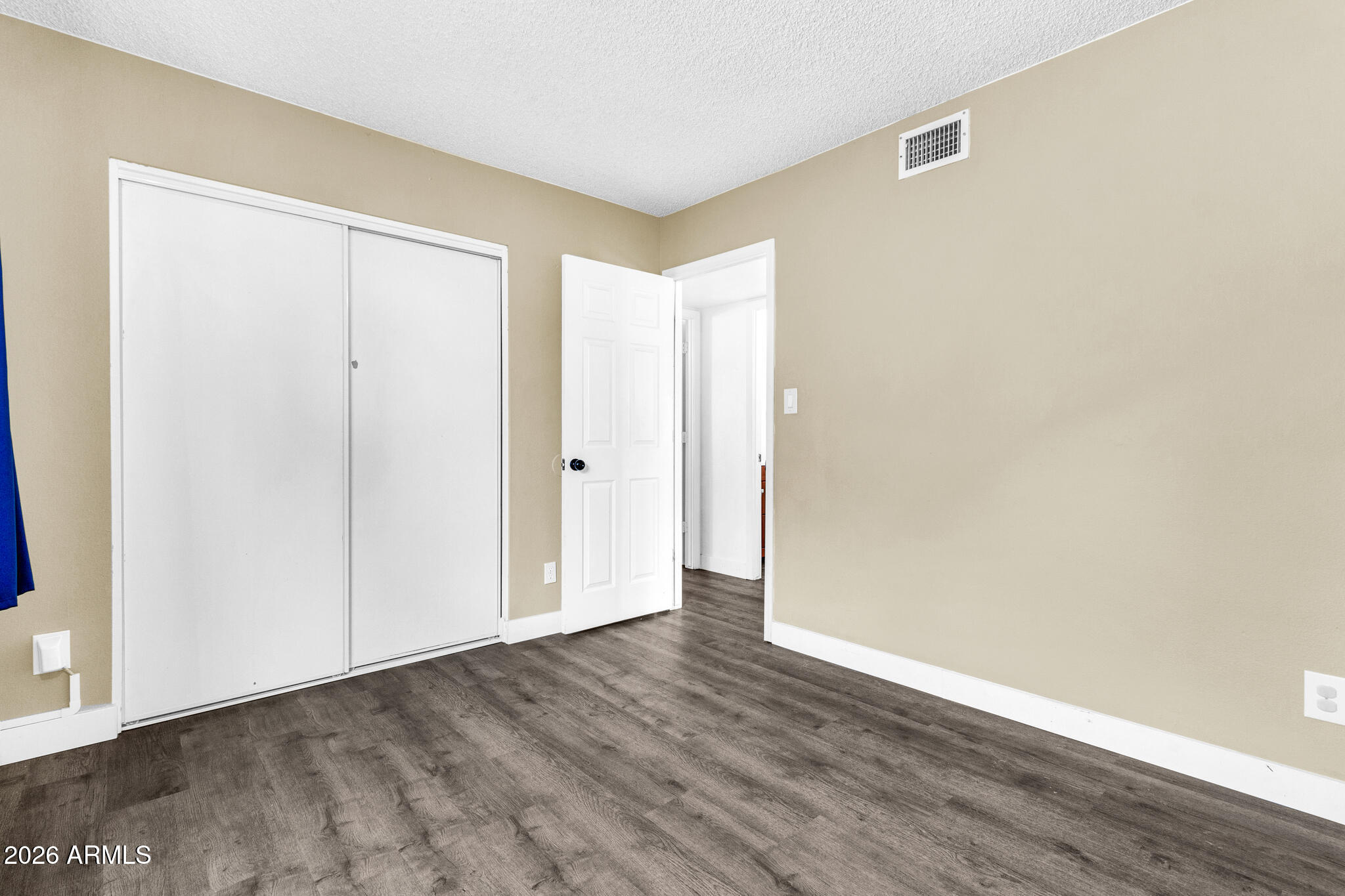 2024 East Rice Drive Tempe, AZ 85283 - Photo 25 of 39 a view of an empty room with wooden floor