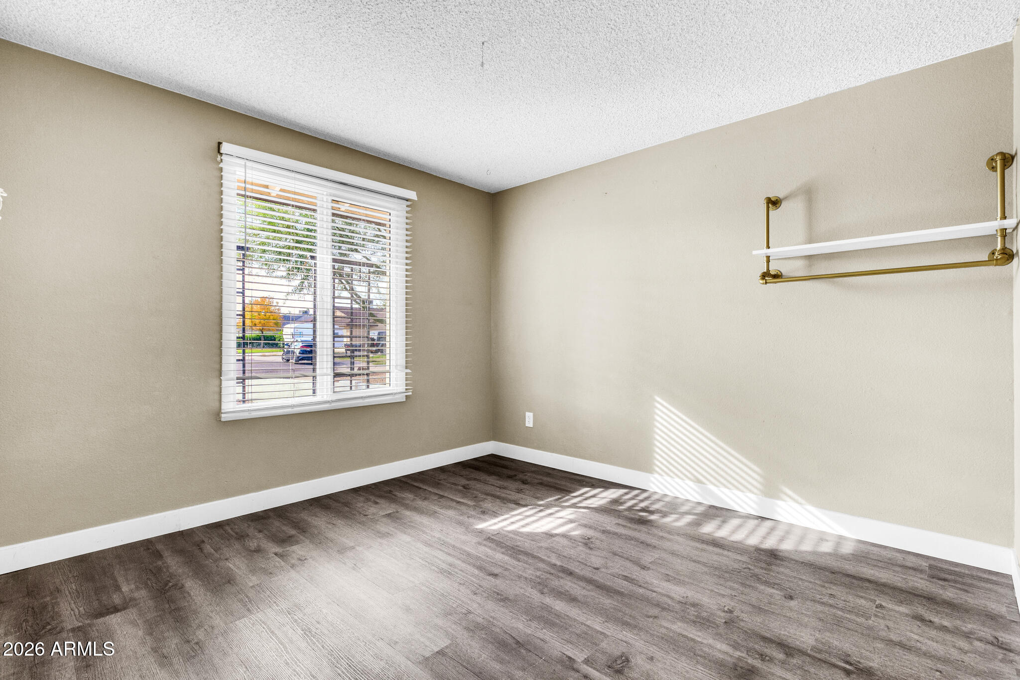 2024 East Rice Drive Tempe, AZ 85283 - Photo 28 of 39 a view of an empty room with wooden floor and a window
