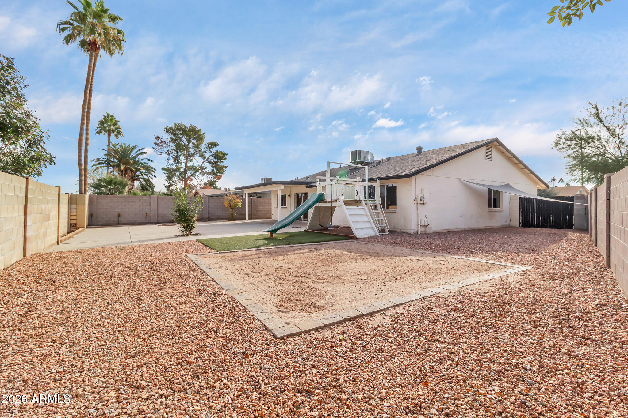 2024 East Rice Drive Tempe, AZ 85283 - Photo 35 of 39 a view of a house with a backyard and a tree