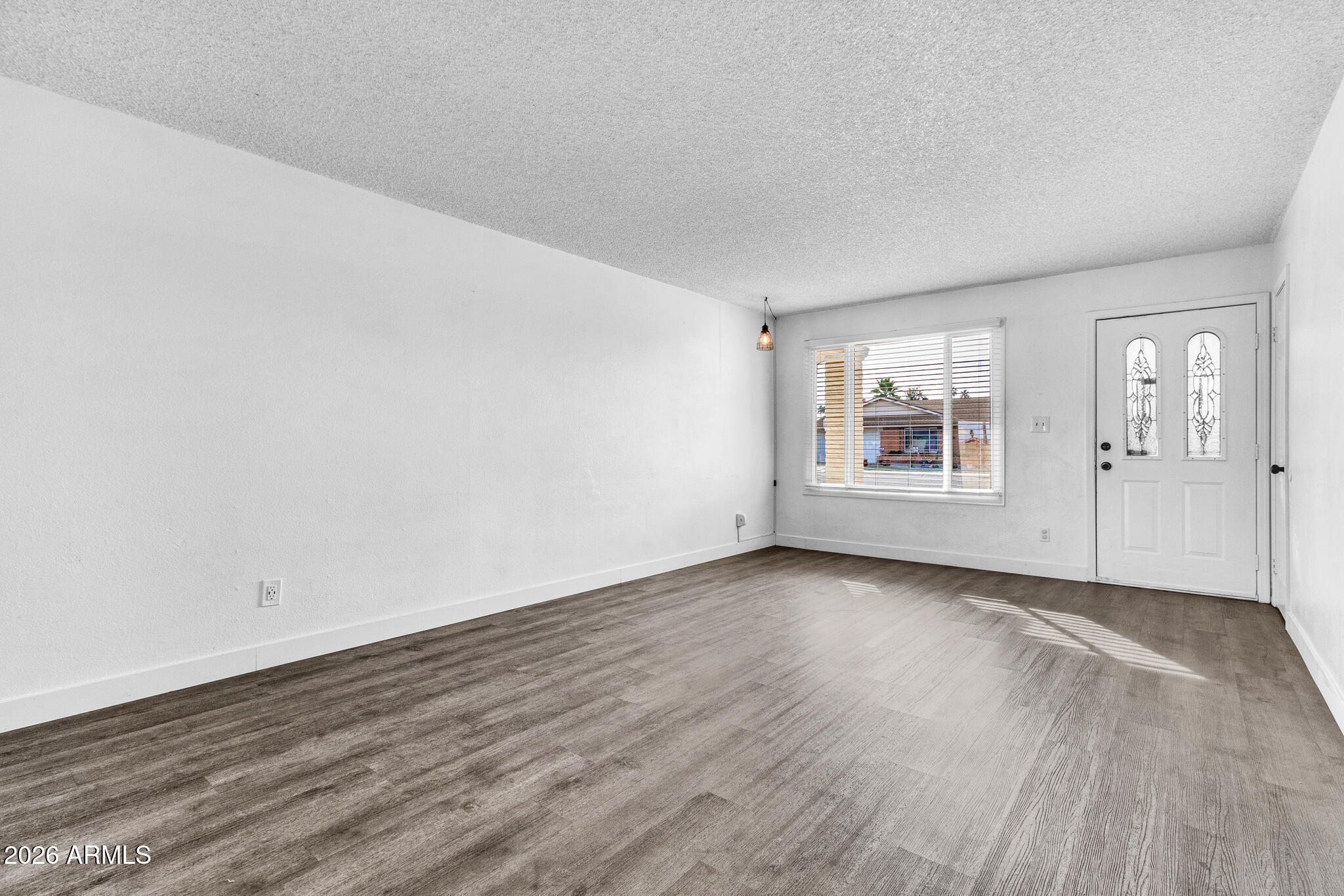 2024 East Rice Drive Tempe, AZ 85283 - Photo 7 of 39 an empty room with wooden floor and windows
