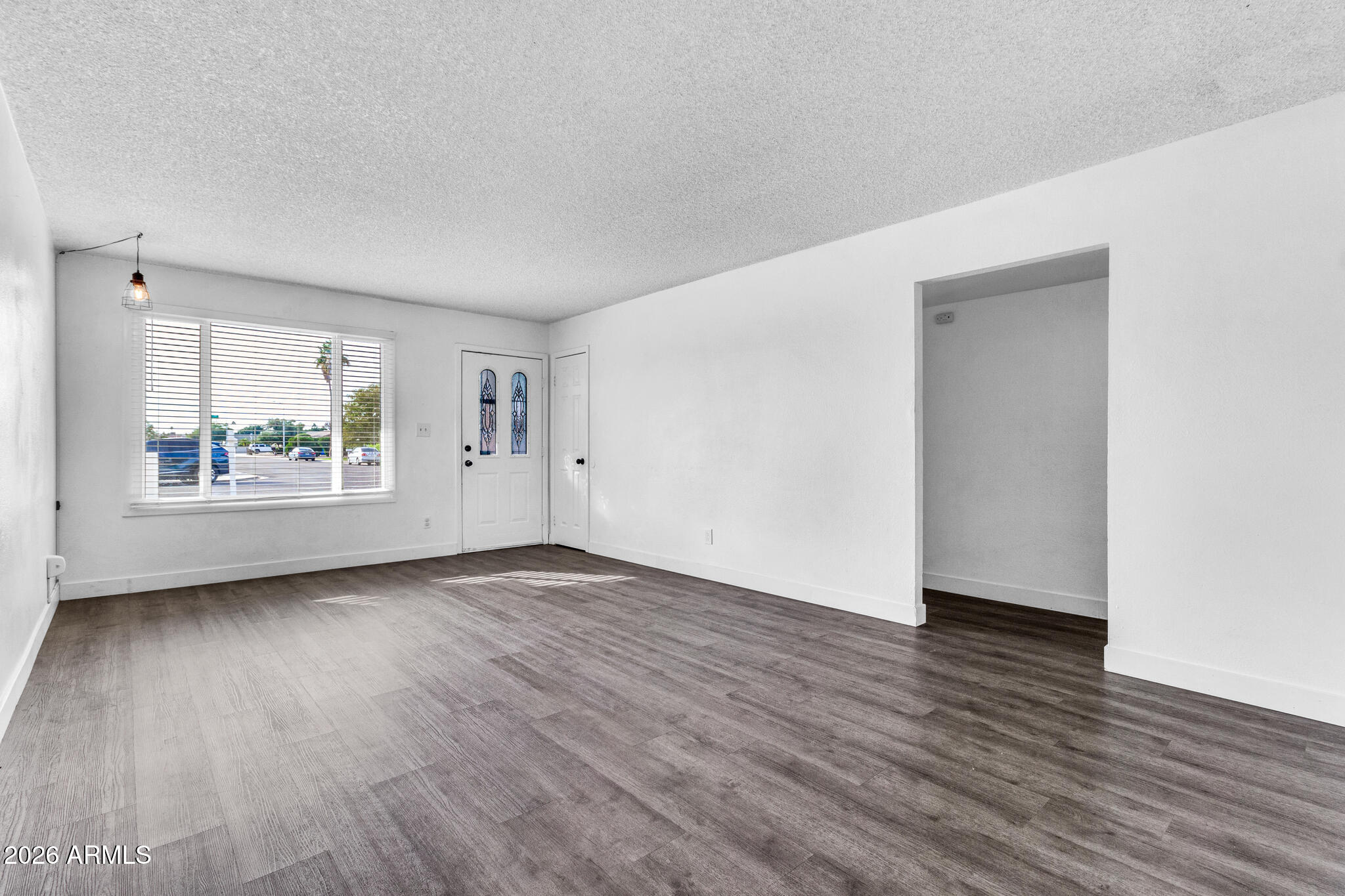 2024 East Rice Drive Tempe, AZ 85283 - Photo 8 of 39 an empty room with wooden floor and windows