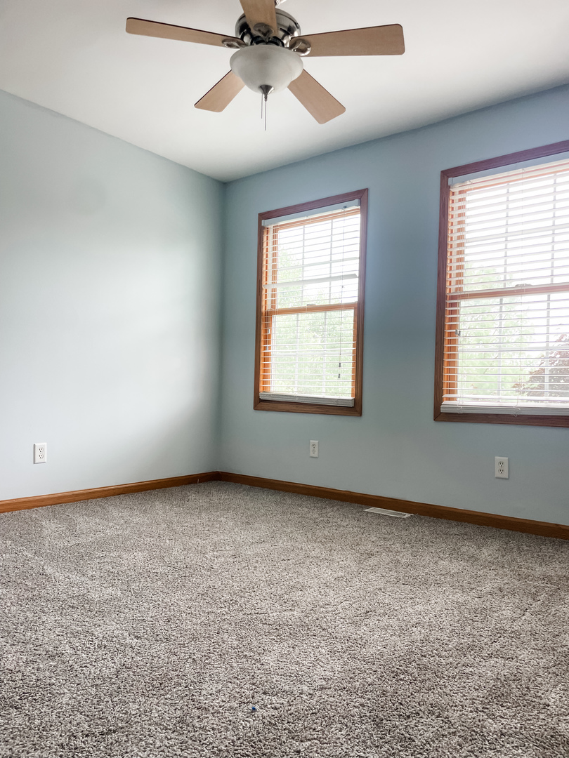 1308 Axcel Lane Sycamore, IL 60178 - Photo 14 of 40 wooden floor in an empty room with a window