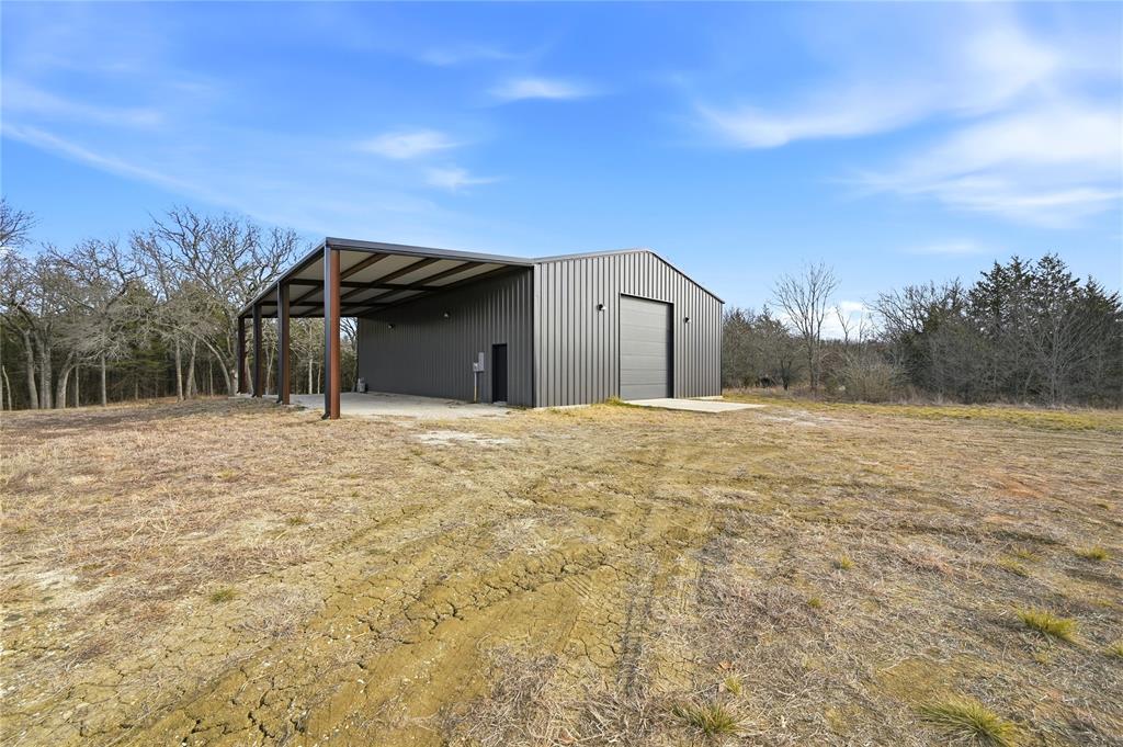 1807 Pink Hill Road Bells, TX 75414 - Photo 12 of 31 a view of a house with a snow in the yard