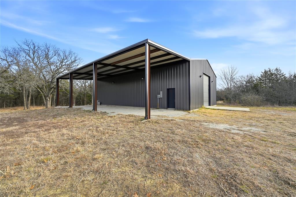 1807 Pink Hill Road Bells, TX 75414 - Photo 13 of 31 a house with trees in the background