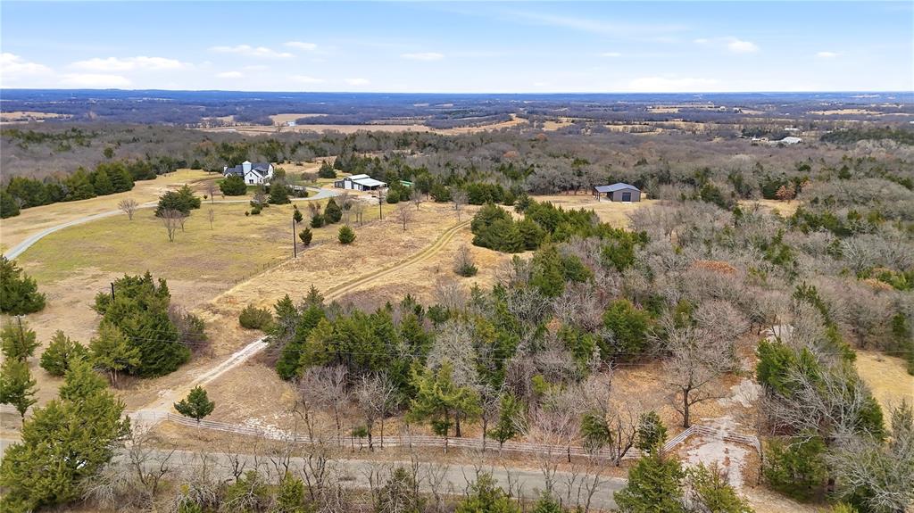 1807 Pink Hill Road Bells, TX 75414 - Photo 27 of 31 an aerial view of residential houses with outdoor space and trees