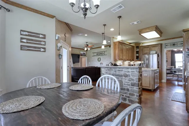 a dining room with furniture and wooden floor